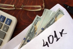 401k written on an envelope with dollars. Savings concept.