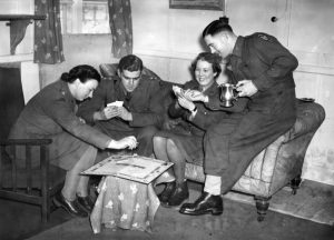 US troops on a transport to Australia playing Monopoly, in 1942