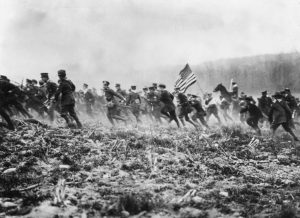 March 1917: American troops preparing for WW I on a mock battlefield. (Photo by Topical Press Agency/Getty Images)