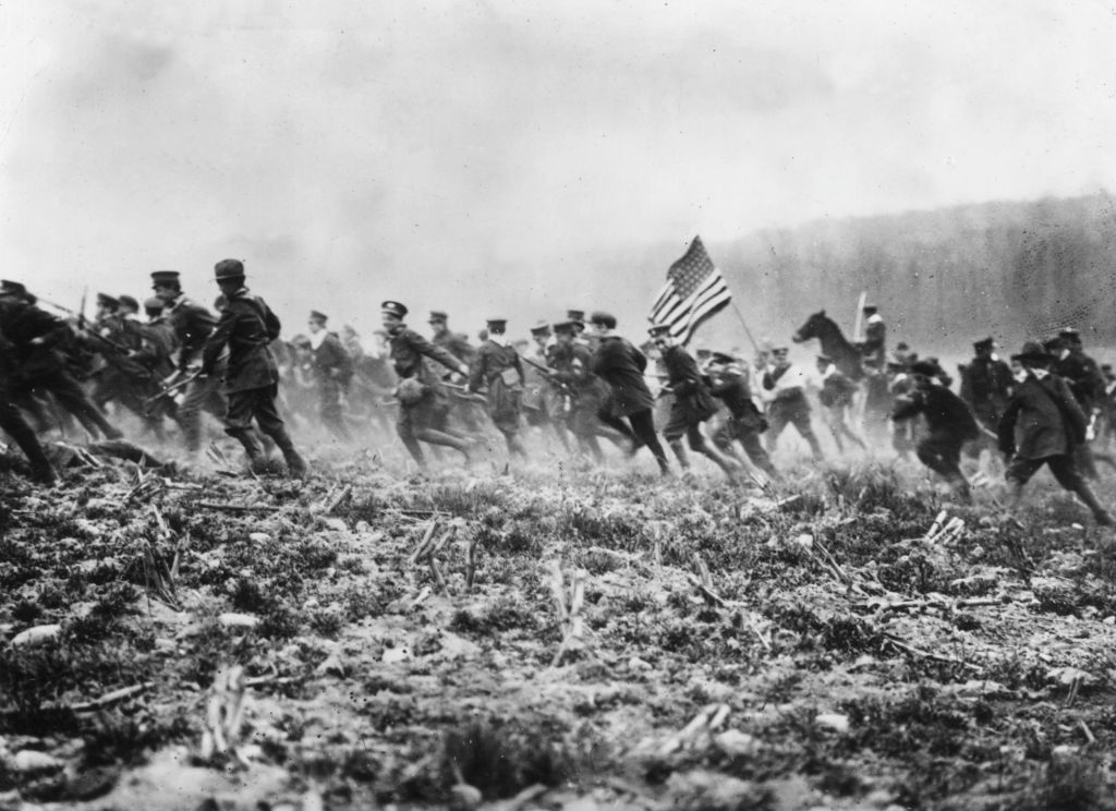 March 1917: American troops preparing for WW I on a mock battlefield. (Photo by Topical Press Agency/Getty Images)