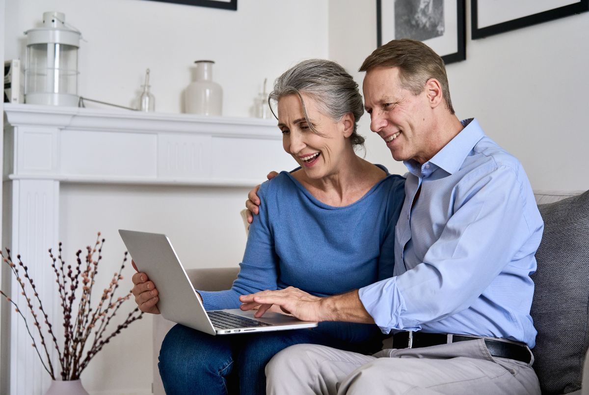 older couple on computer for medicare annula enrollment period