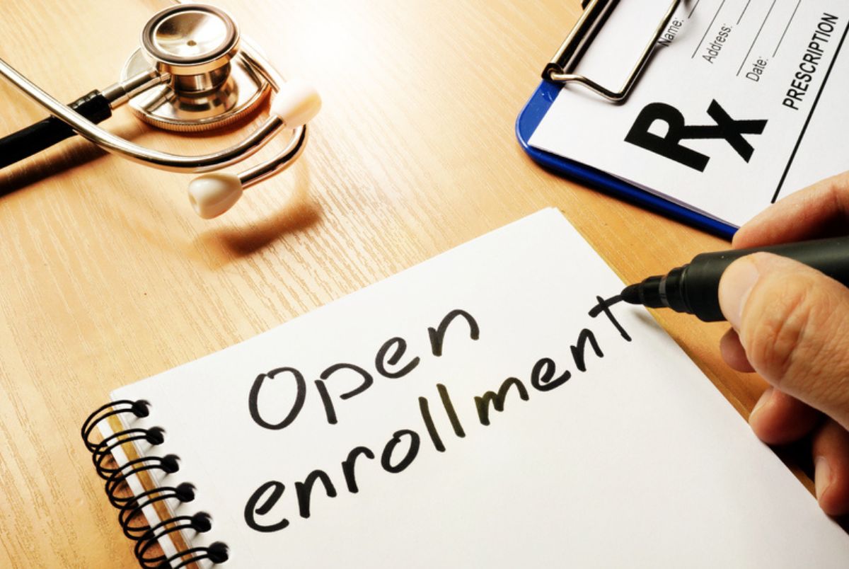 medicare annual enrollment and open enrollment periods; pad of paper and stethoscope