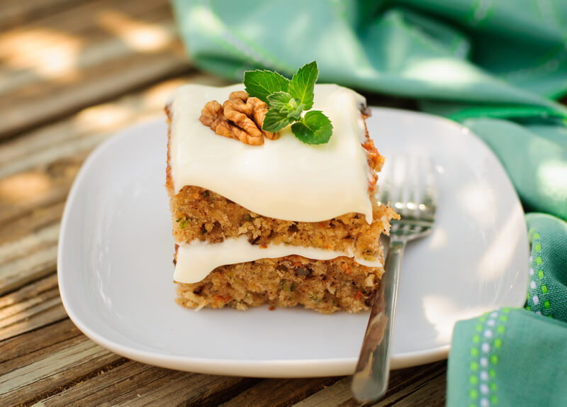 zucchini cake on a plate with a fork